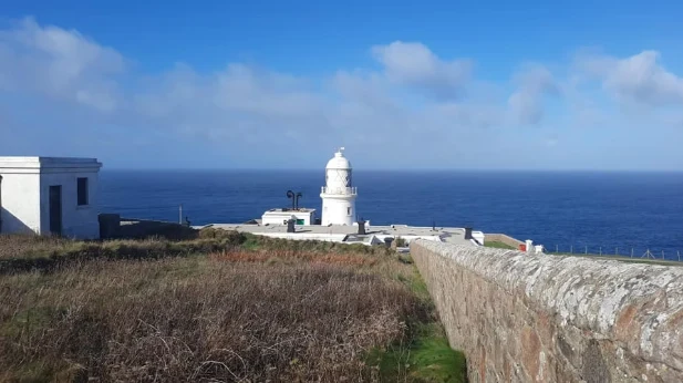 A lighthouse on the Cornish coast, on the Lighthouse Marathon & Ultra route